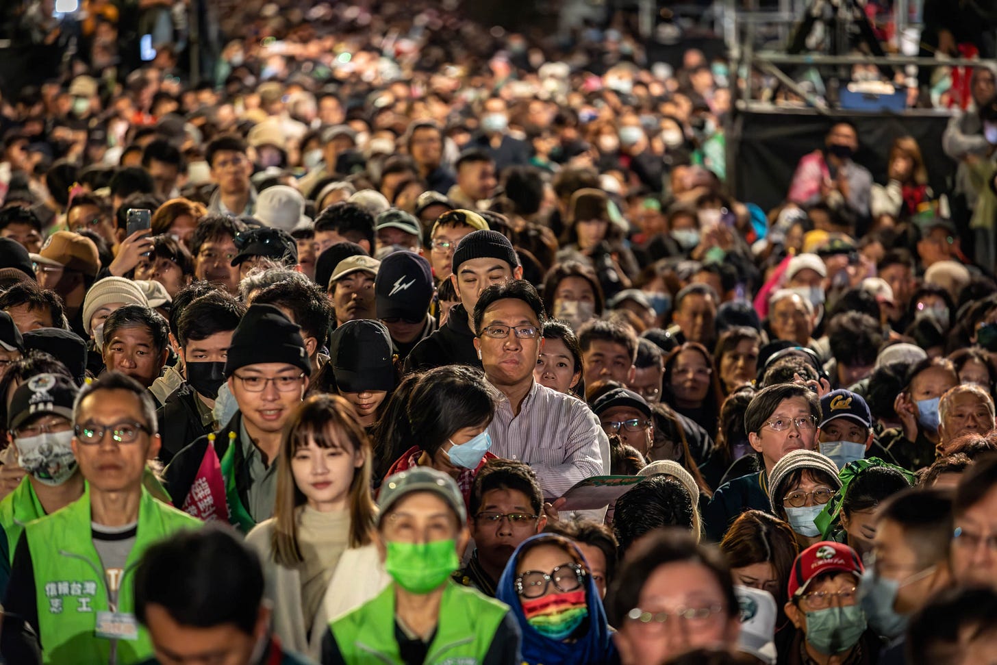 Supporters listen to Lai Ching-te on election night. (Photo by Alex Chan Tsz Yuk/SOPA Images/LightRocket via Getty Images.)