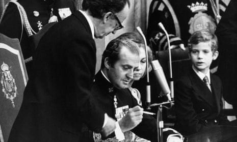 King Juan Carlos I of Spain signs the Spanish Constitution of 1978 at a special joint meeting of parliament in Madrid, establishing Spain as a democracy, 27 December 1978.