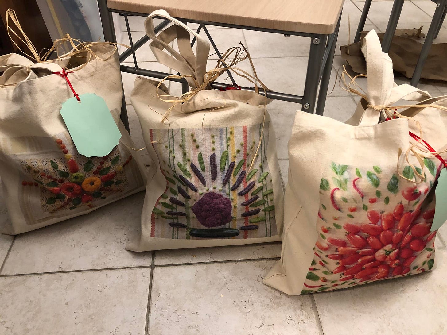 three reusable totes with harvest imagery