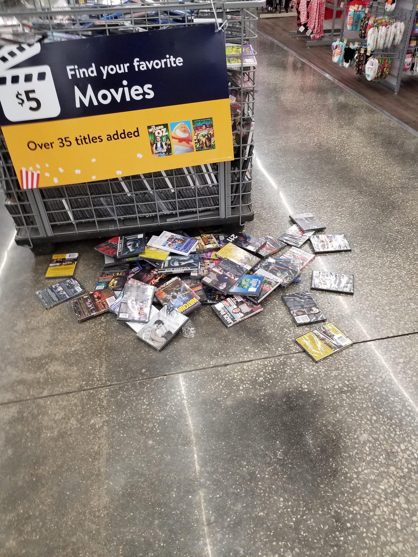 Saw 2 people digging through the $5 movie bin when I went to help other  customers. Came back a few minutes later to this. : r/walmart