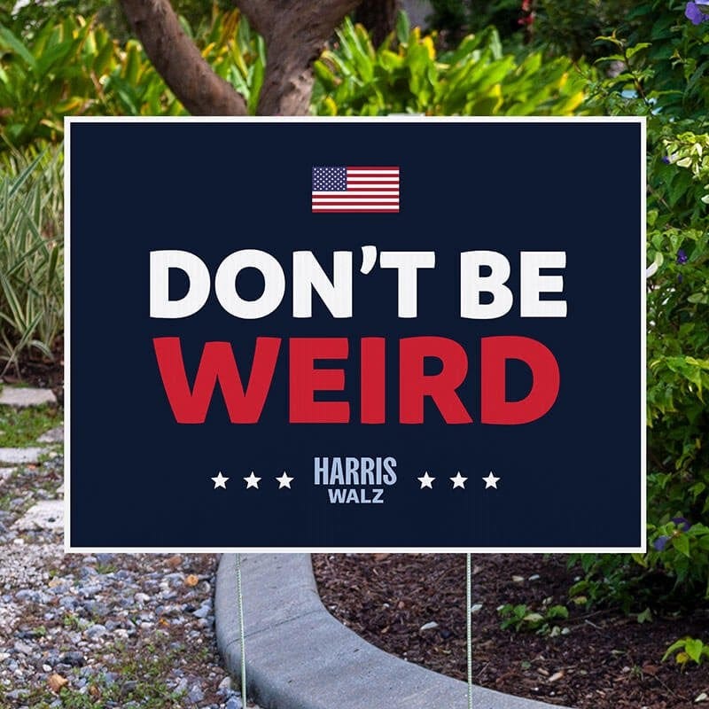 Don't Be Weird | Harris Walz Yard Sign next to pavement