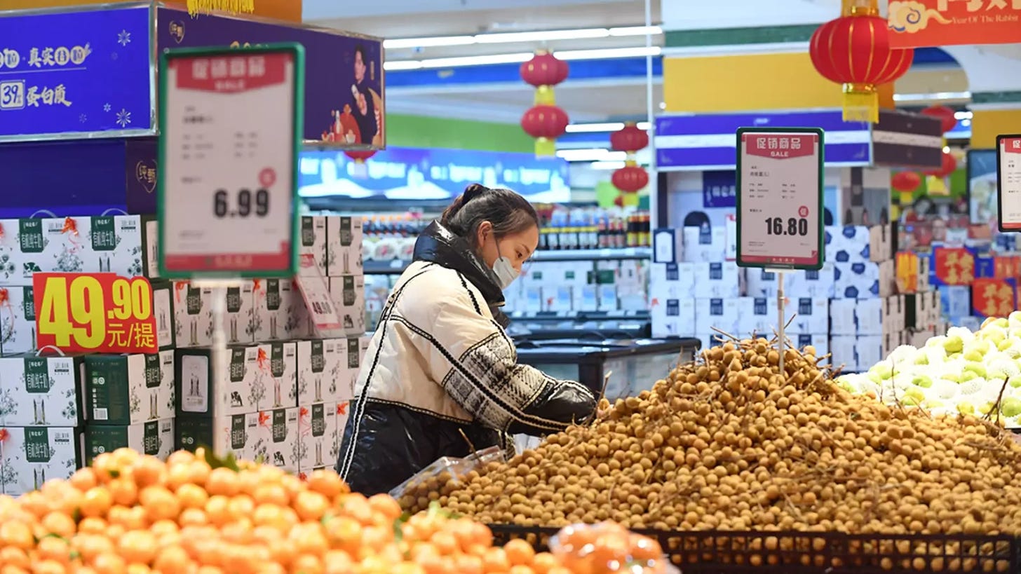 People shop at a supermarket in China’s Guizhou Province.