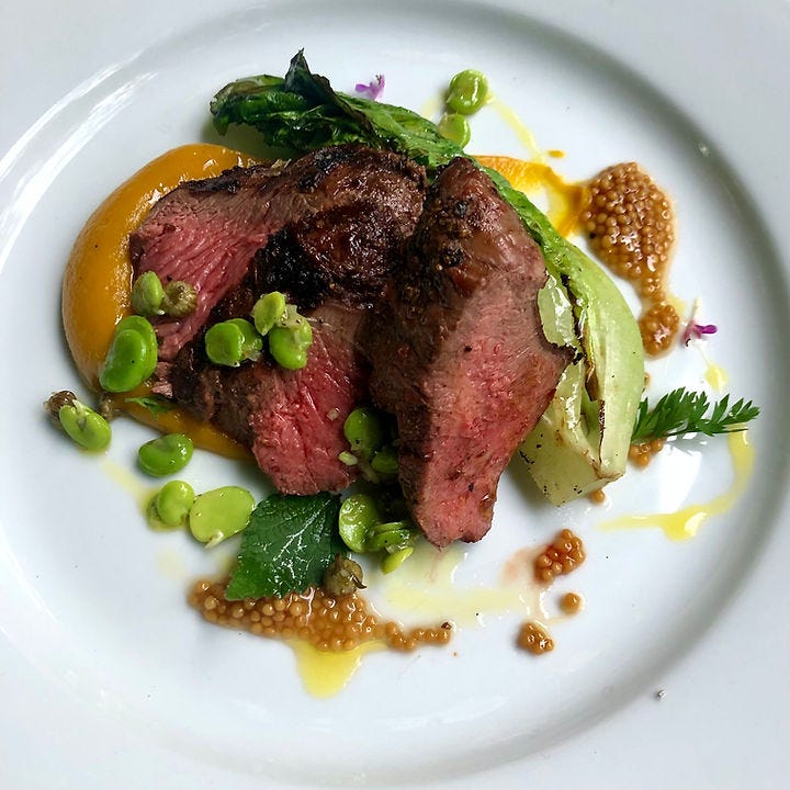 Venison chump with smoked carrot ketchup, charred lettuce, mustard pickle & broad bean dressing