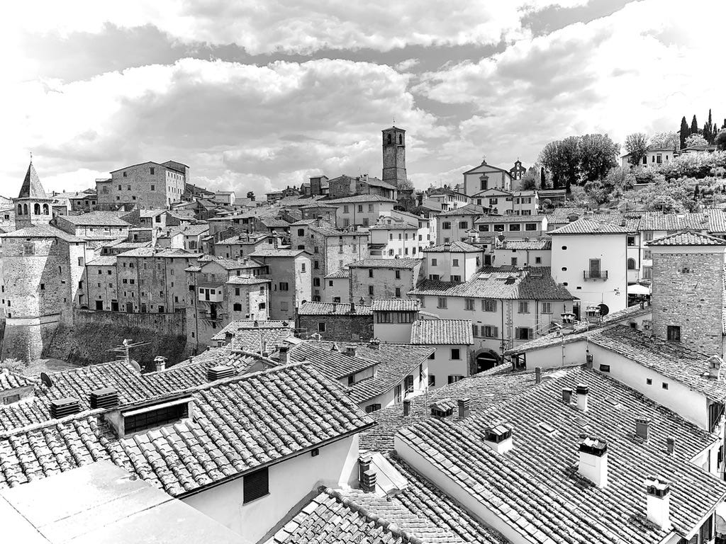 A black and white photo of a city

AI-generated content may be incorrect.