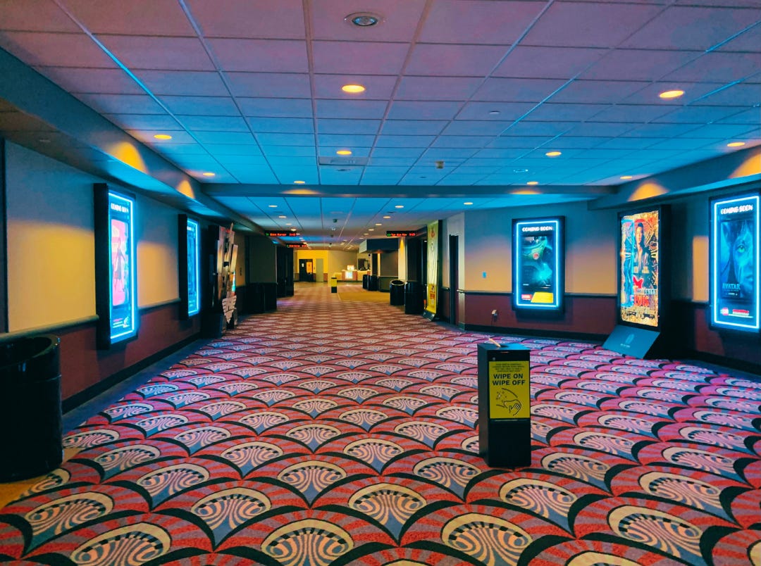 the empty hallway of a movie theater