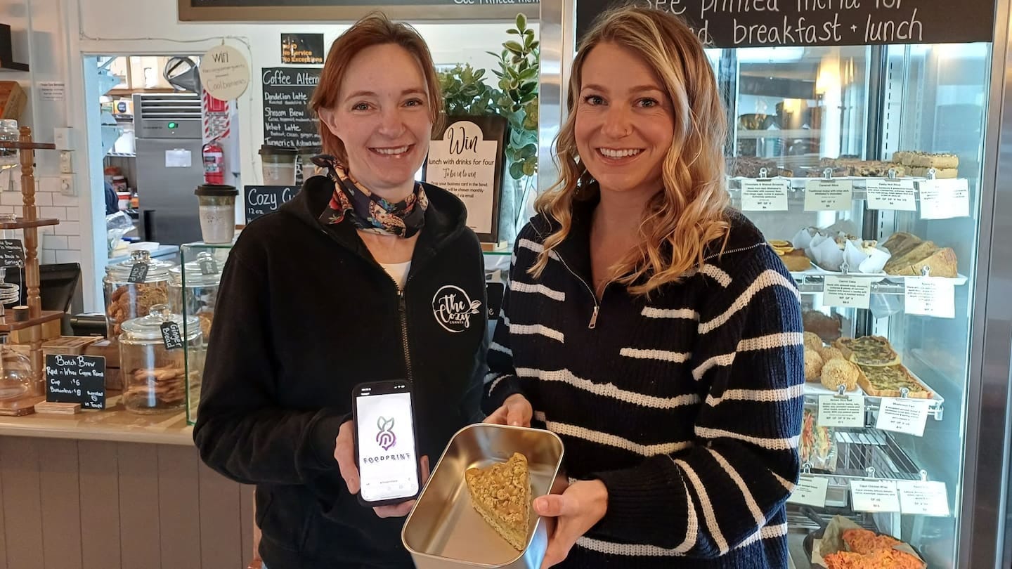 Camilla Baker from Cozy Corner Cafe and Taupō District Council waste minimisation officer Shannon Hanson with some of the food on offer on the Foodprint app.