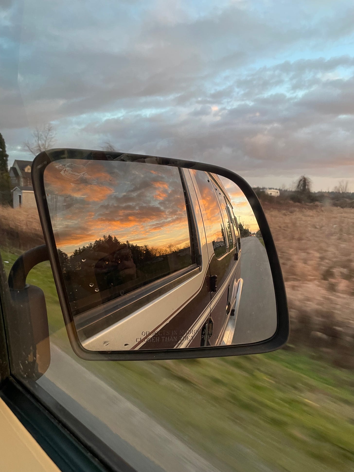 watch sunset through the mirror in our van 