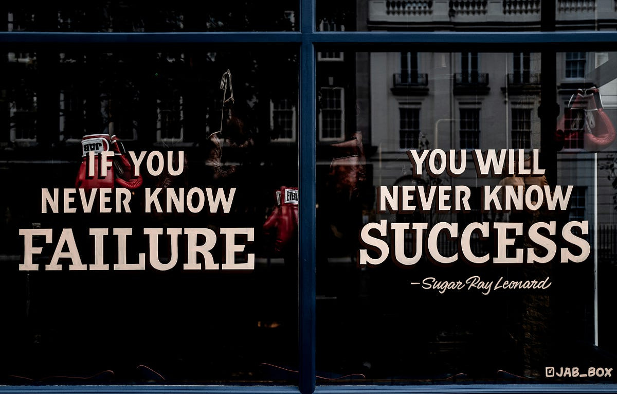 Two Signs, “If You Never Know Failure” and “You will never know Success”.