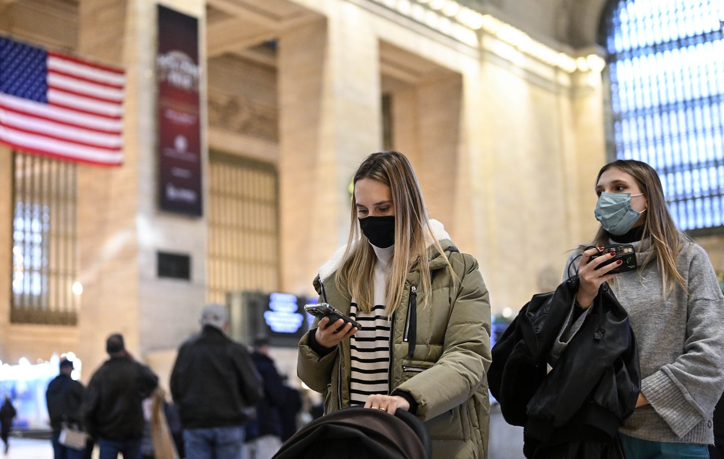 People wear masks in New York City's Grand Central Station.