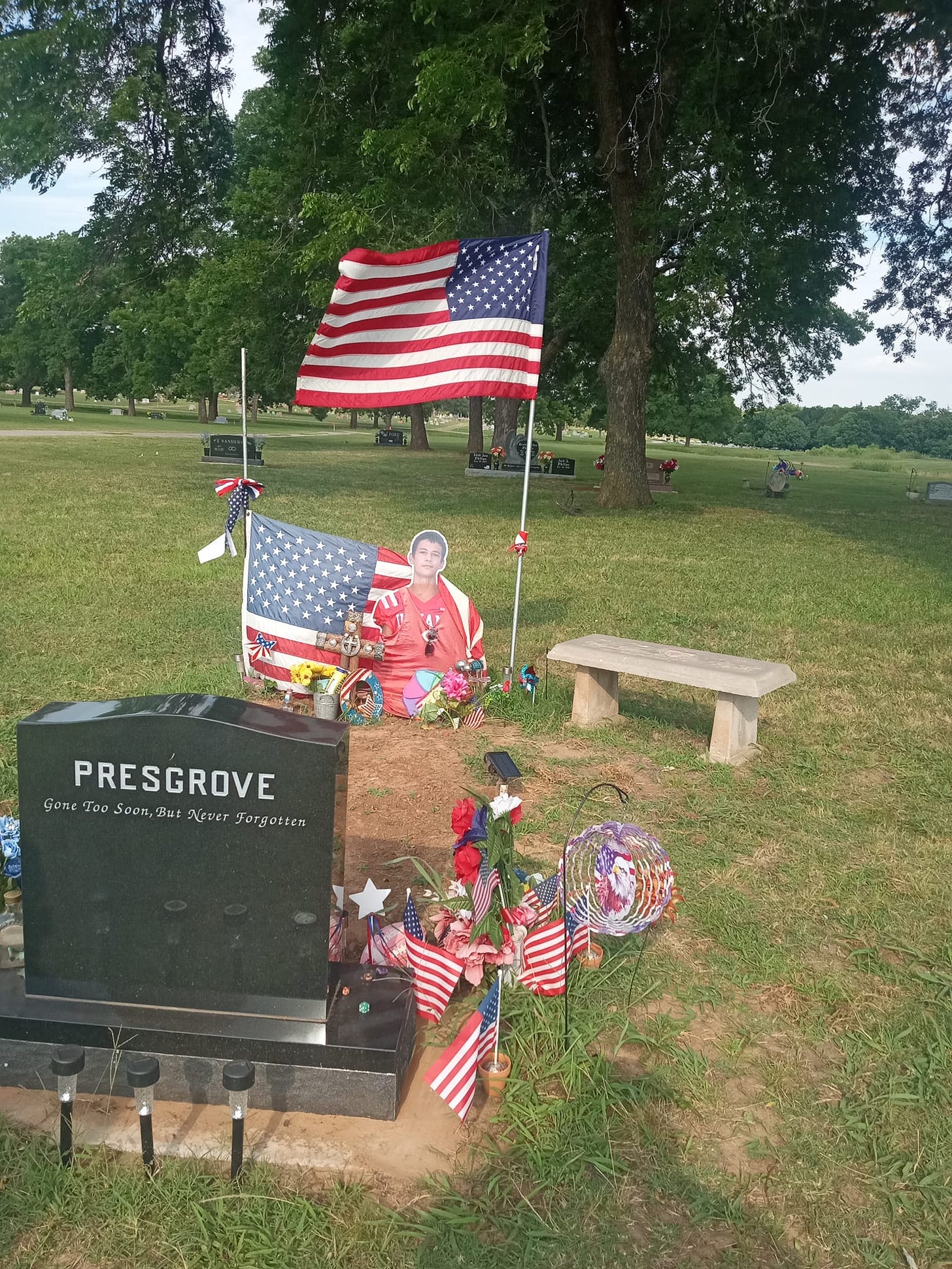 May be an image of 2 people, monument and text