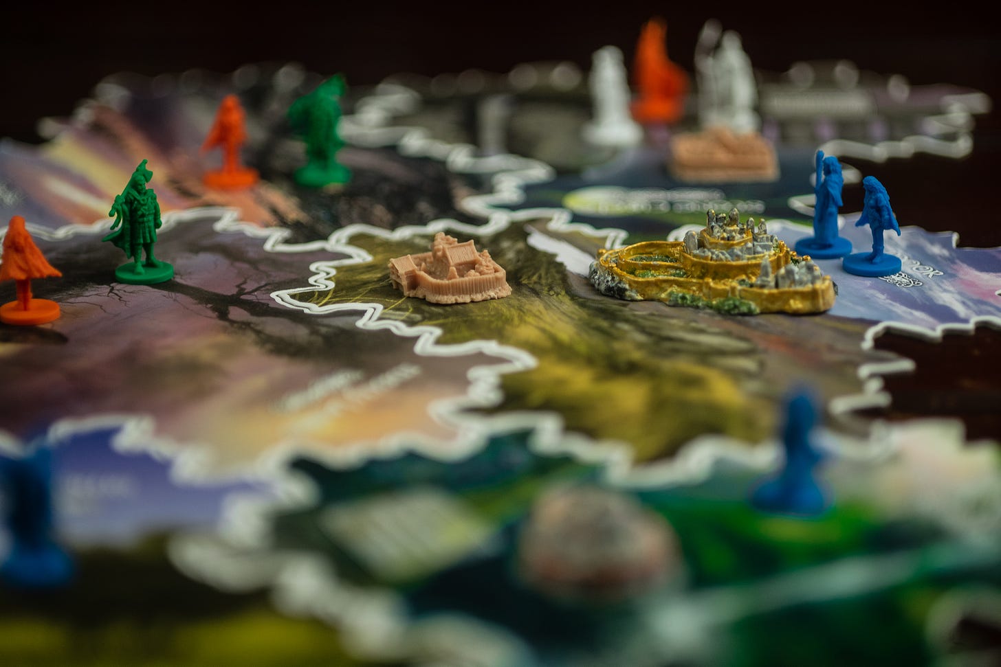 The board game Inis. There are figures representing different players, a citadel, and a sanctuary.
