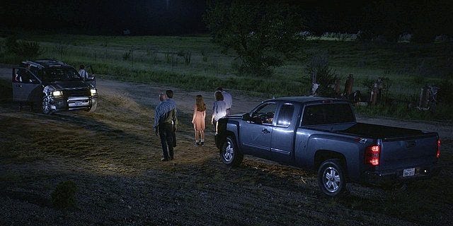 Walker family outside in trucks confronting Stan.