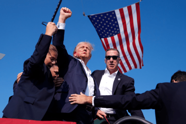 Former President Trump and presumptive GOP nominee for U.S. President moments after narrowly surviving an assassination attempt on Saturday, July 13, 2024. (photo: Evan Vucci/AP)