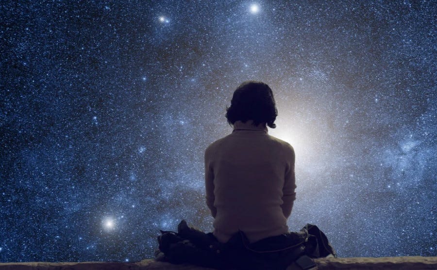 woman looking at starry sky