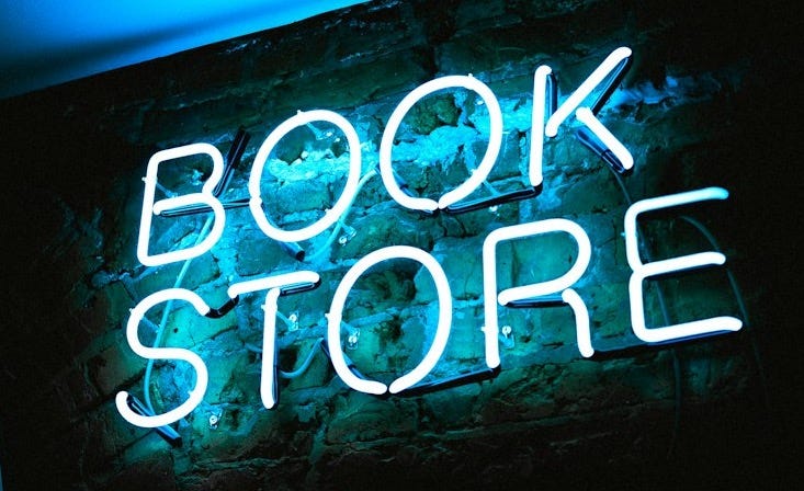blue Book Store neon signage blue Book Store neon signage