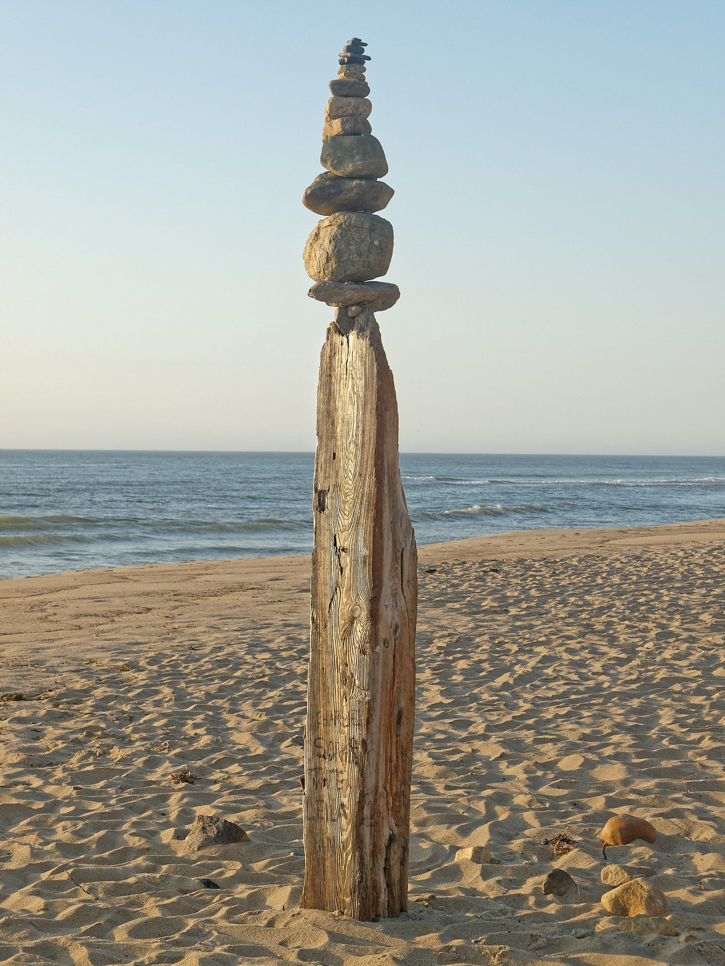 rocks balance on post at beach