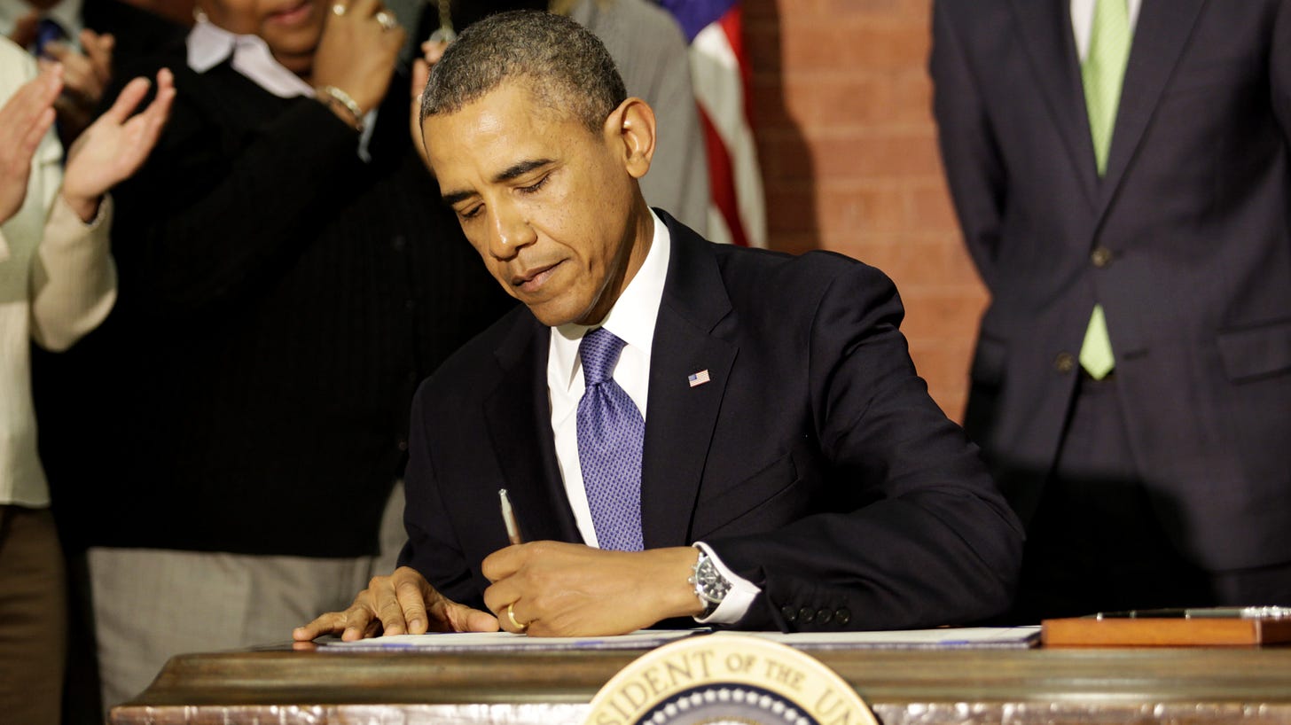 President Obama signing
