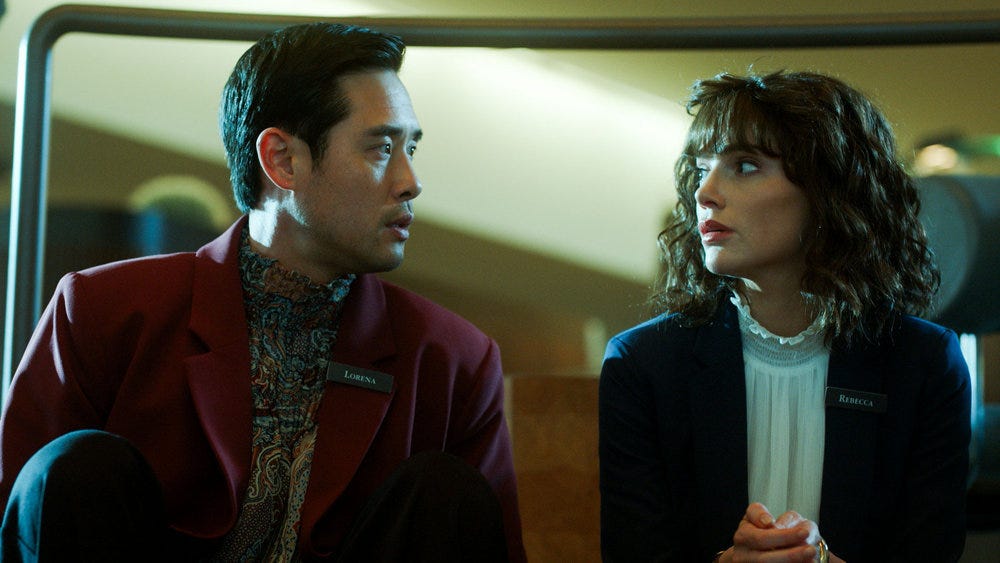 Still from Quantum Leap Season 2 Episode 2 of Raymond Lee as Dr. Ben Song and Janet Montgomery as Rebecca pictured from left to right