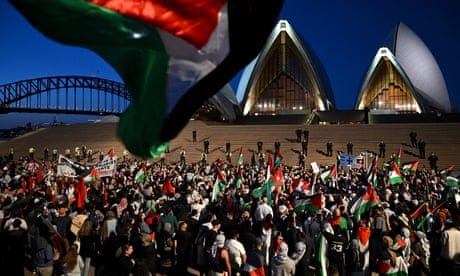 Pro-Palestine protesters on Monday night marched to the Sydney Opera House, which was lit up in white and blue in solidarity with Israel. Pro-Palestine protesters on Monday night marched to the Sydney Opera House, which was lit up in white and blue in solidarity with Israel.