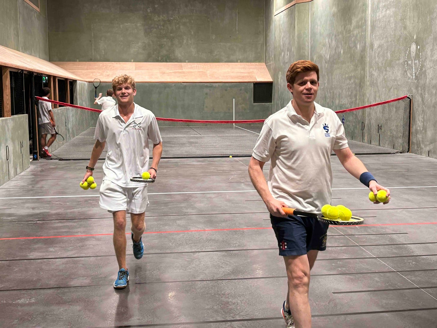May be an image of 3 people and people playing tennis