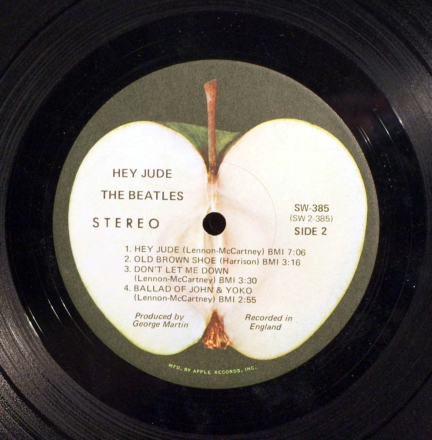 A close-up of a vinyl of Hey Jude by The Beatles