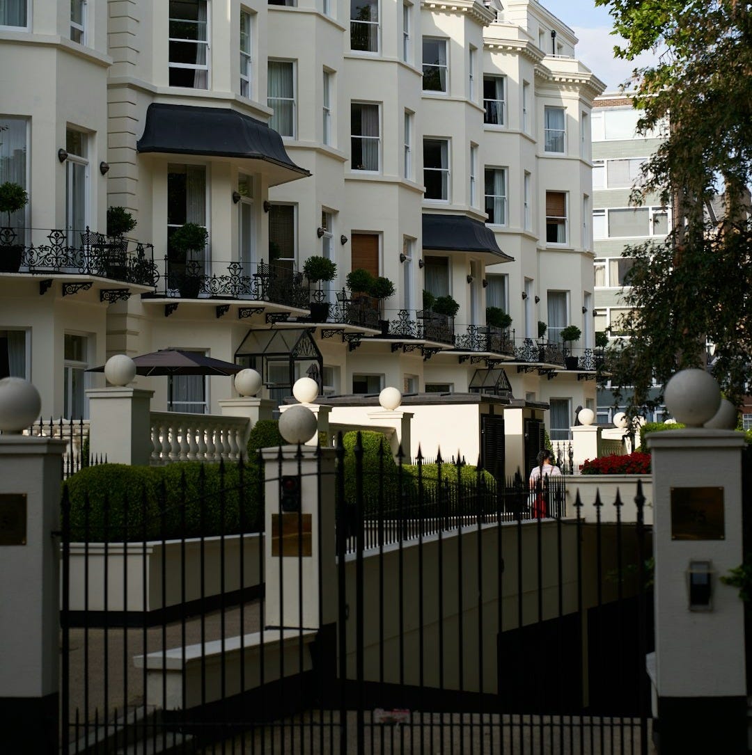 A large white building with many balconies A large white building with many balconies