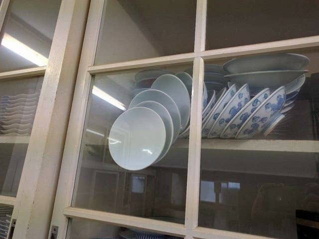 The Viral Photo Of Bowls Trapped In A Cupboard Was Actually Taken During An  Earthquake