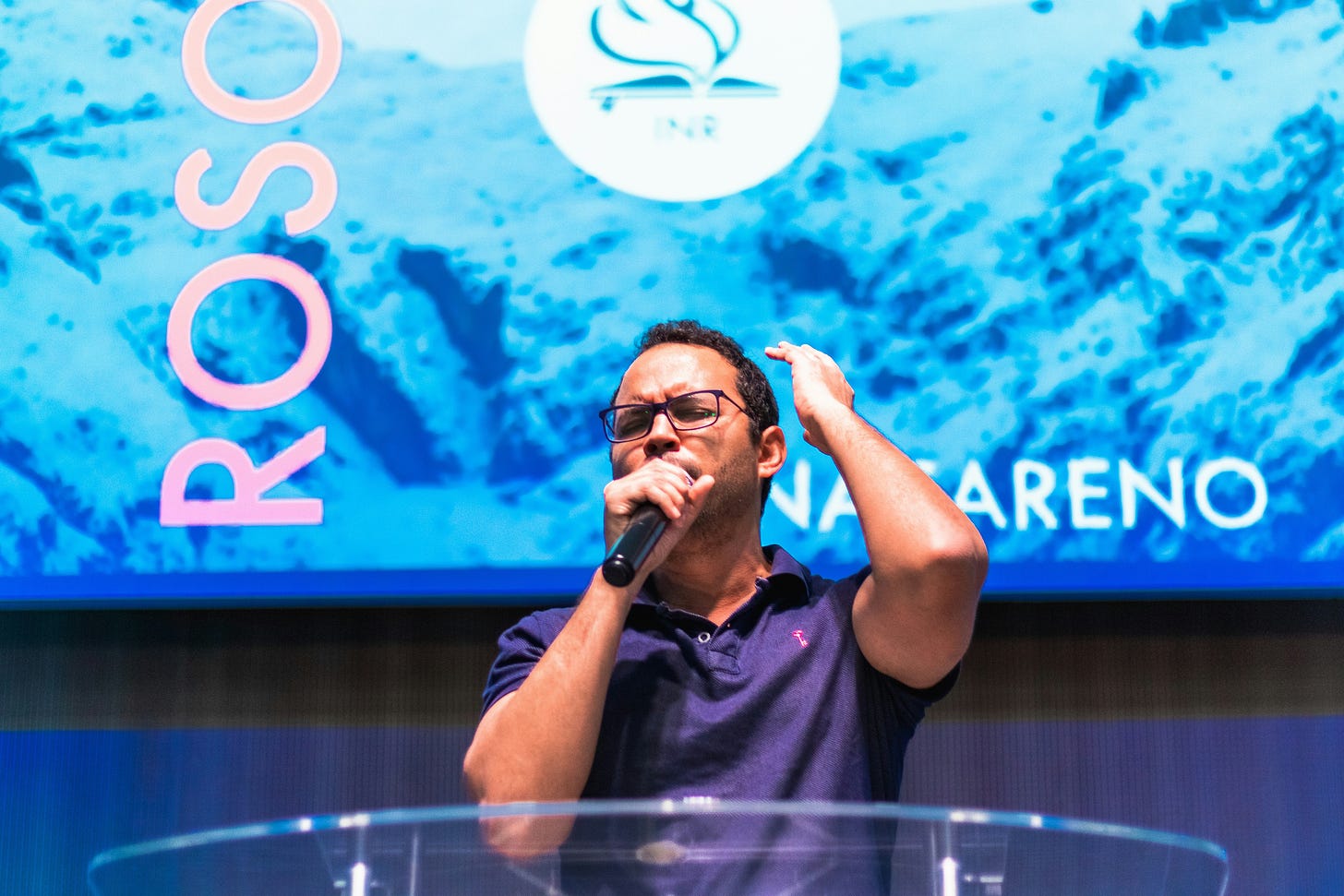 Photo of pastor praying in church