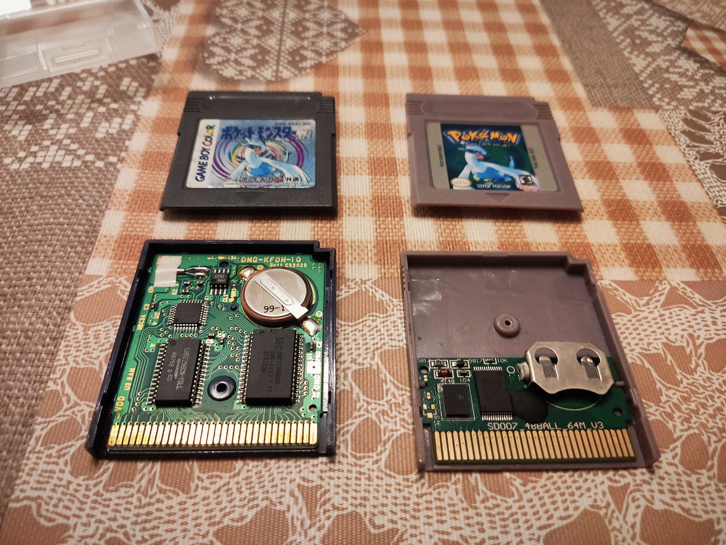 Copies of Pokémon Silver. Left side is a genuine Japanese cartridge, right side is a reproduction (Photo credit: Lucent)