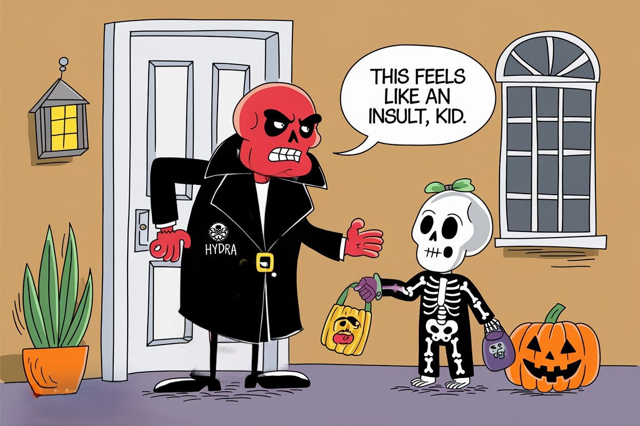 Cartoon illustration: Red Skull, dressed in his black Hydra trenchcoat outfit, opens the door to a trick-or-treating kid during Halloween. The kid is dressed up as a skeleton. Red Skull, annoyed, says “This feels like an insult, kid.”