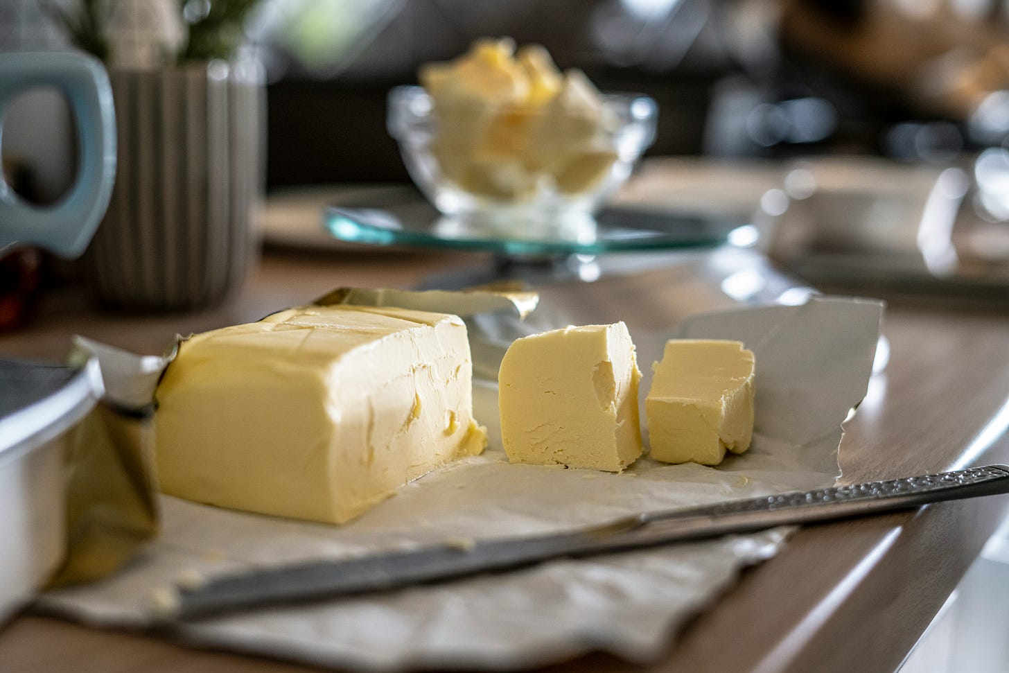 Slices of butter on a worktop in a kitchen