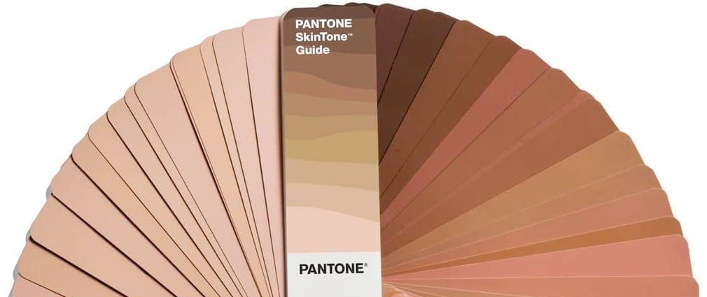 A fan of coloured colour samples from the Pantone skintone guide