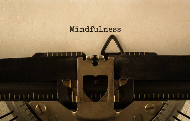 Text Mindfulness typed on retro typewriter stock photo