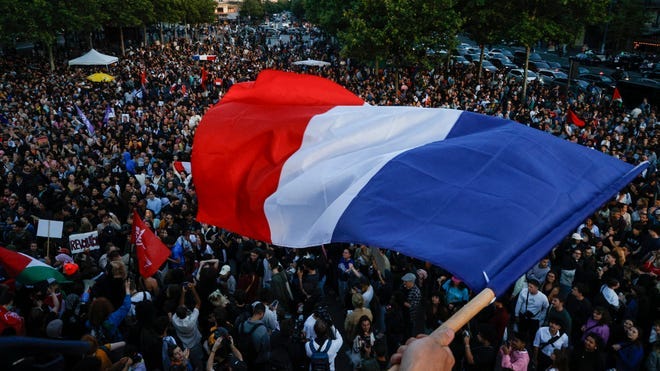 French leftist coalition wins most seats in snap election