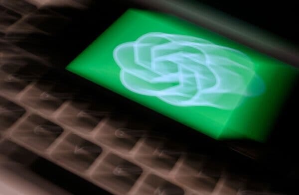 An illustration of a device displaying the OpenAI logo in green on top of a keyboard, which appears blurry from movement.