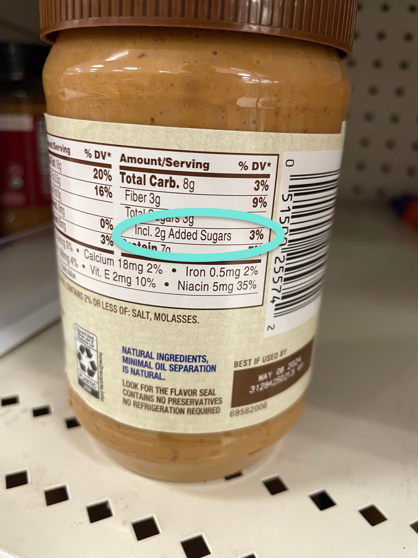 Peanut butter container highlighting added sugars