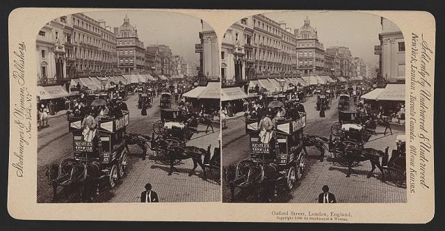 black and white photo of a busy street