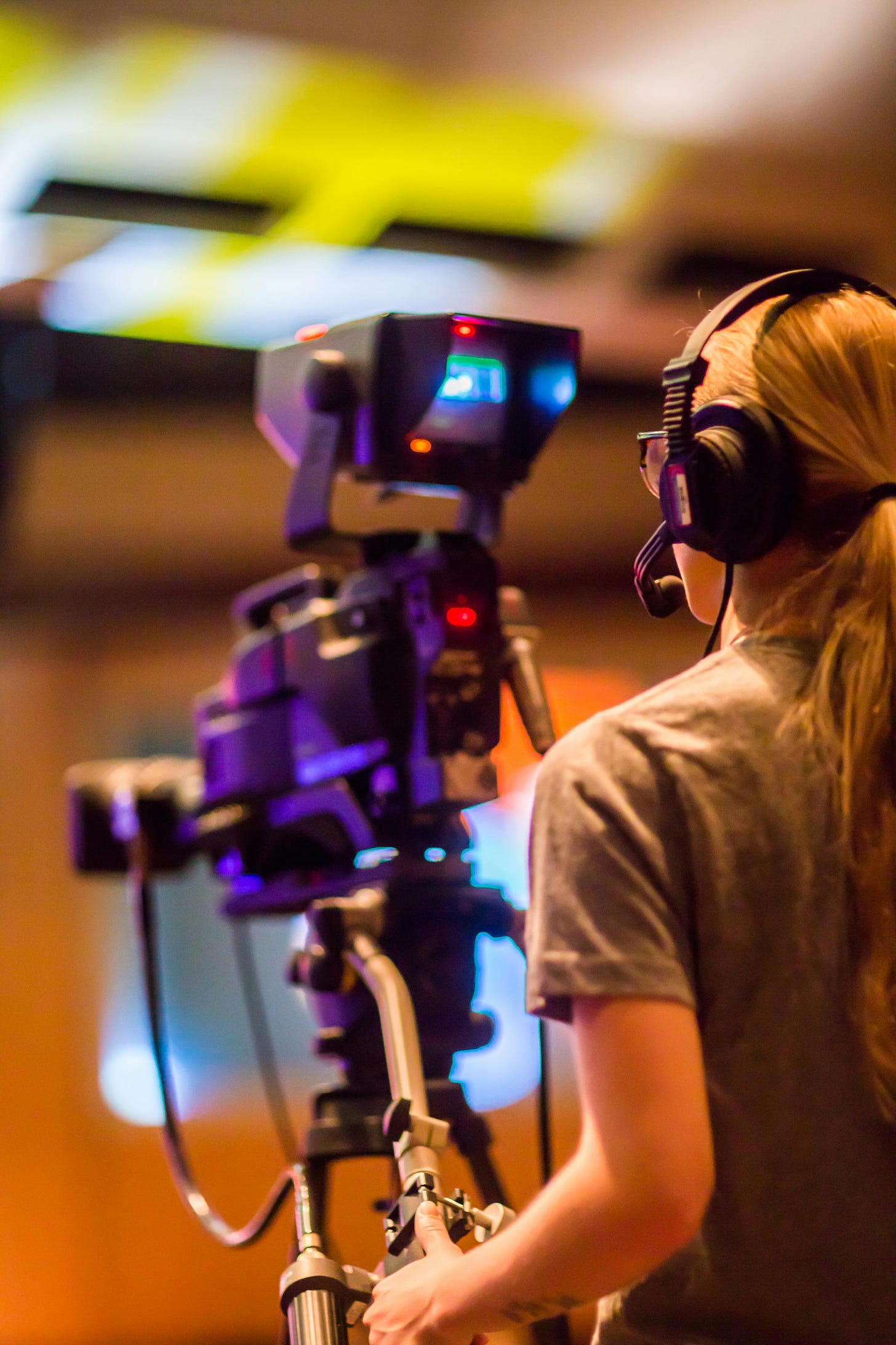 Camera woman behind a TV camera