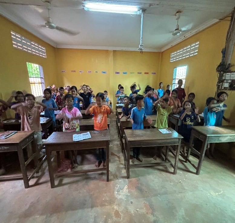 A group of people in a classroom A group of people in a classroom