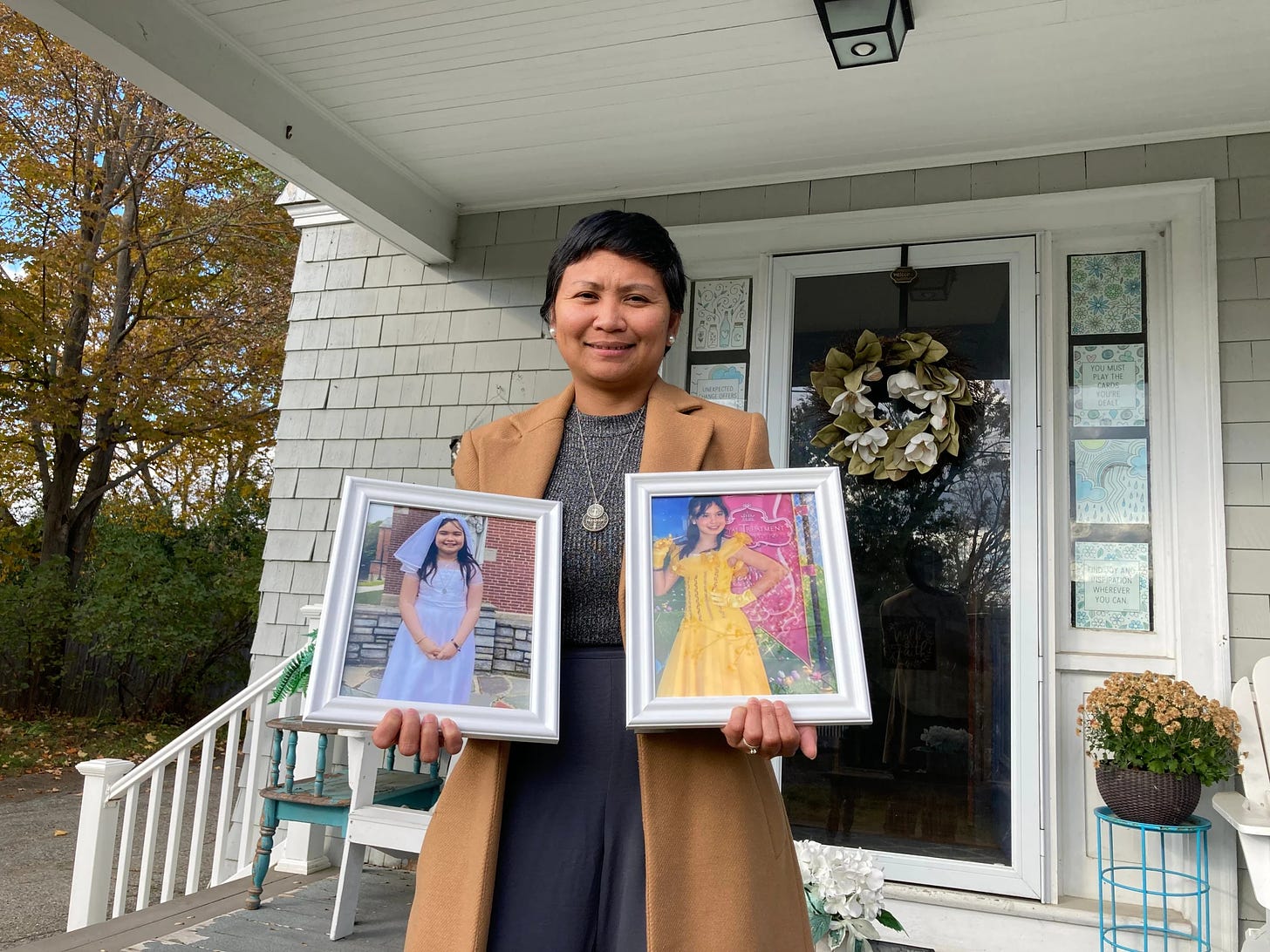 Elisa Nichols holds framed photographs of her late daughter, Lavender Nichols, on Thursday, Oct. 19, 2023, at her family's home in Greenland. Lavender Nichols died at 10 from brain cancer at Boston Children's Hospital on Monday, Oct. 16.