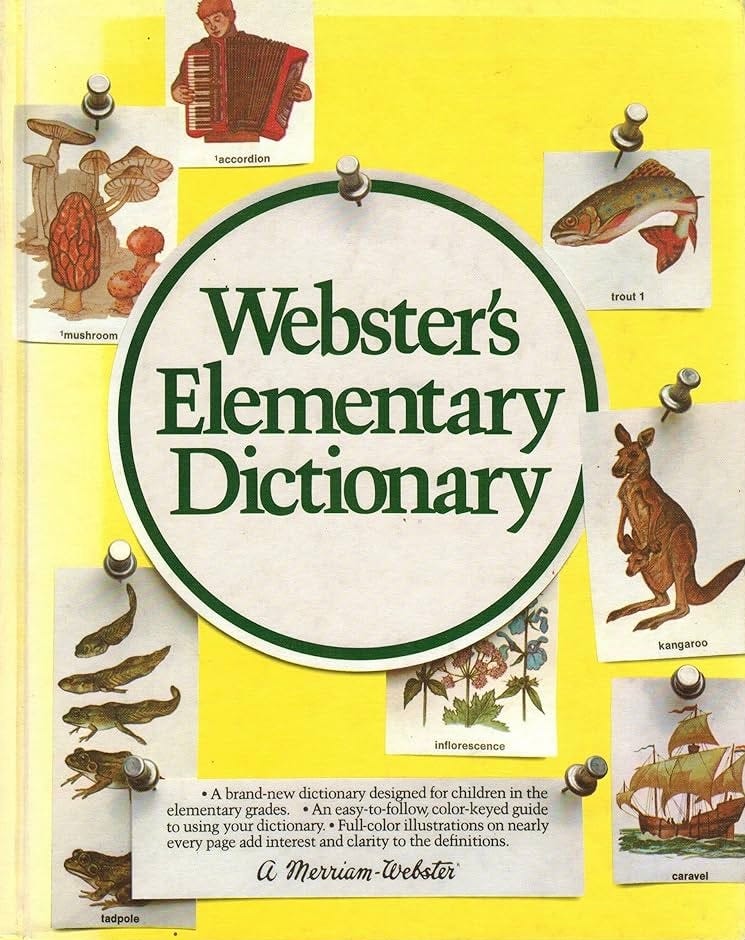 Yellow childhood dictionary by Webster's. Pushpins show images like tadpoles and mushrooms.