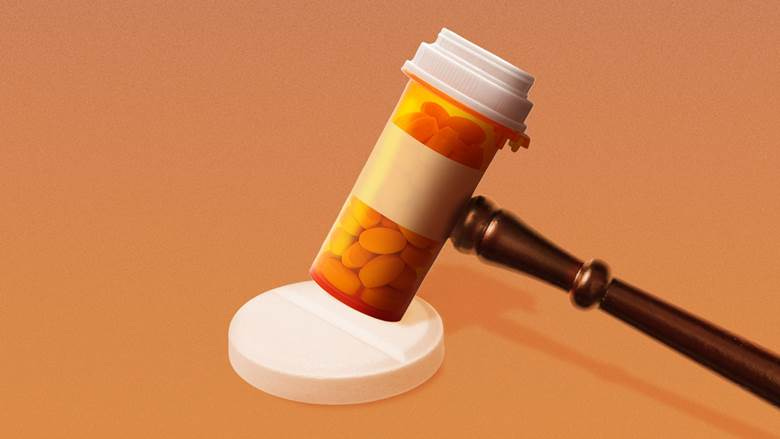 A pill bottle with a hammer

Description automatically generated