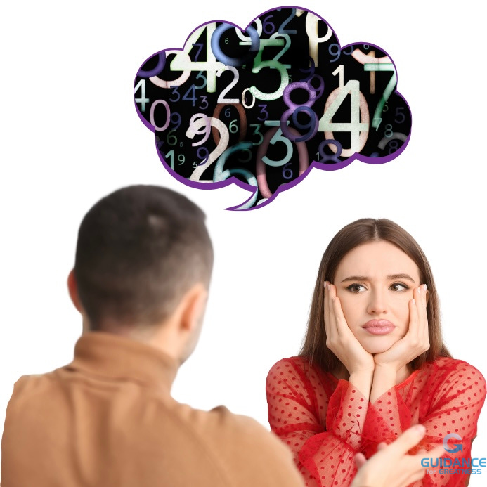 A man sits with his back to the viewer. He has a word balloon filled with a jumble of colorful numbers. A woman faces him and the viewer with her chin in her hands. She is giving him a sidelong glance and looks bored and annoyed.