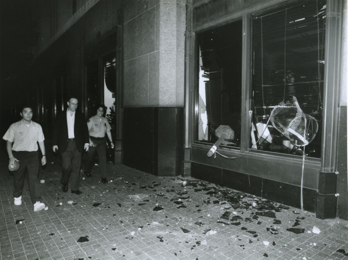 Broken-out windows of the Los Angeles Times building on Spring Street south of 1st Street in the aftermath of the Rodney King trial.