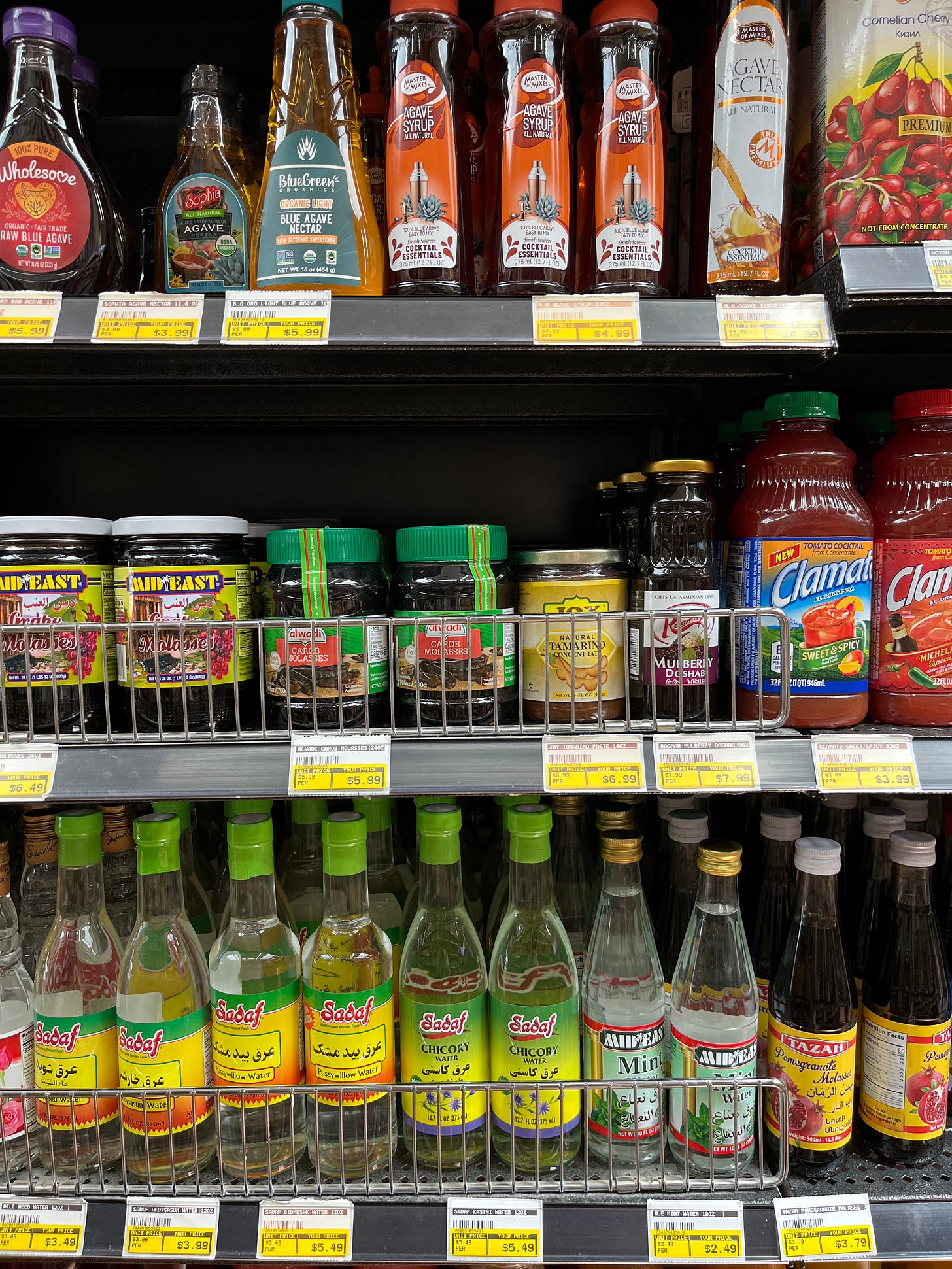 A display of sauces on a supermarket shelf