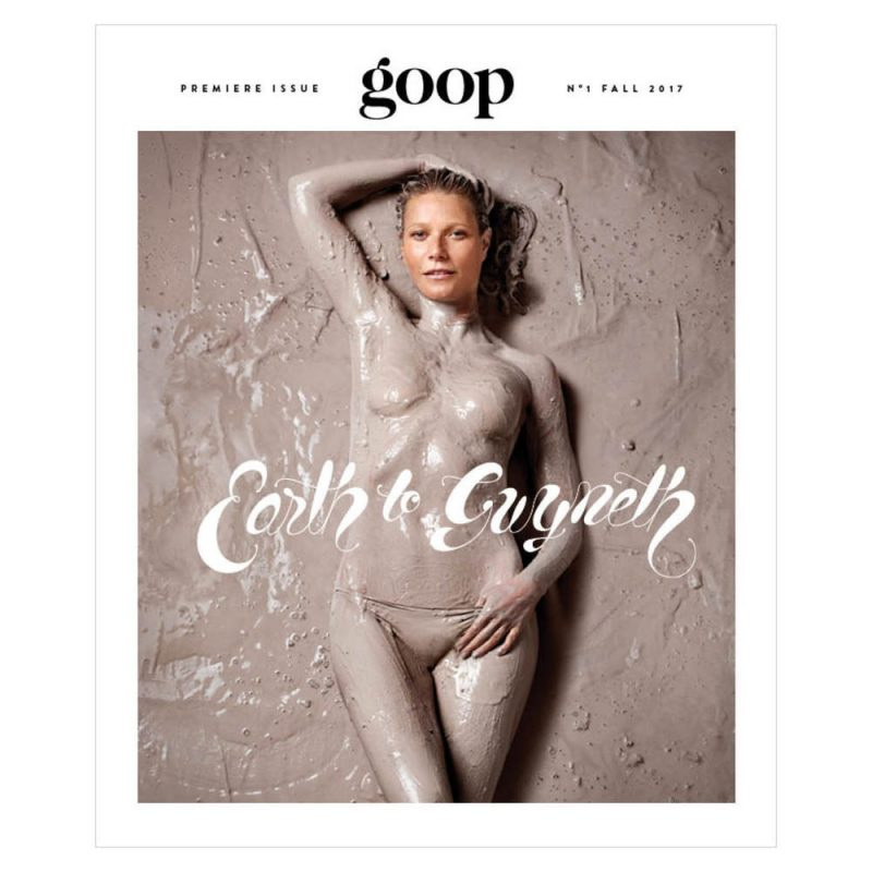 Gwenyth Paltrow lying on her back in mud, topless, her entire body covered in mud except for her face, on the first issue of goop magazine, with the title Earth to Gwyneth