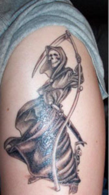 a tattoo of the character DEATH on my forearm