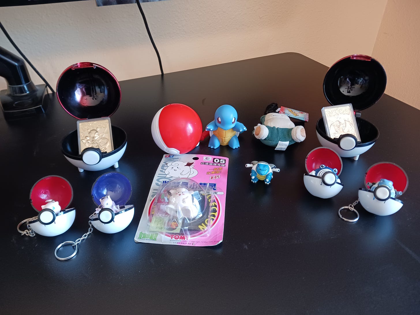 A selection of random Pokémon toys, including some gold-plated Pokémon cards from Burger King