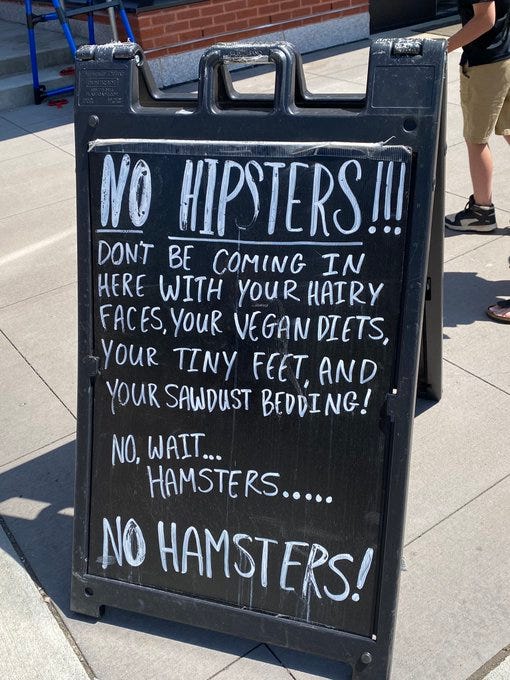 A sign that says “No hipsters” but then describes hamsters before realizing the mistake