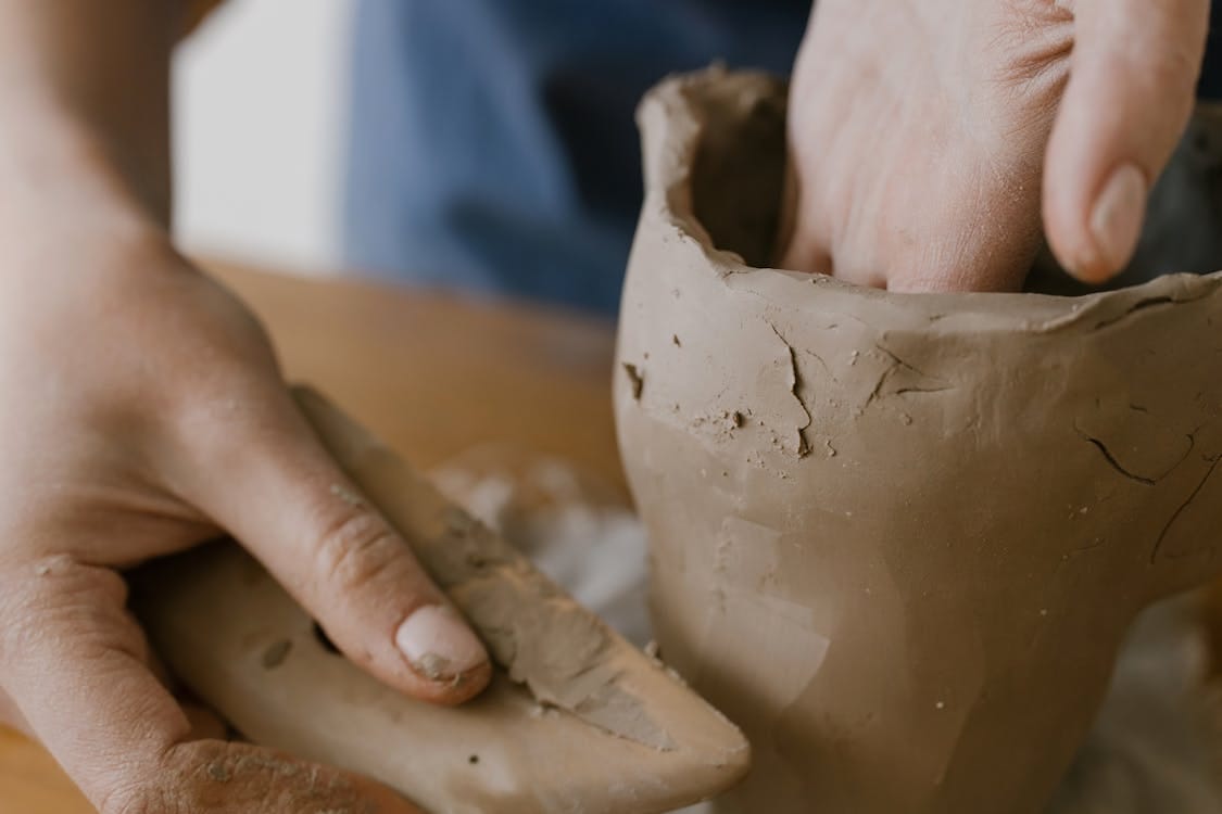 Free A Person Shaping a Soft Clay Stock Photo